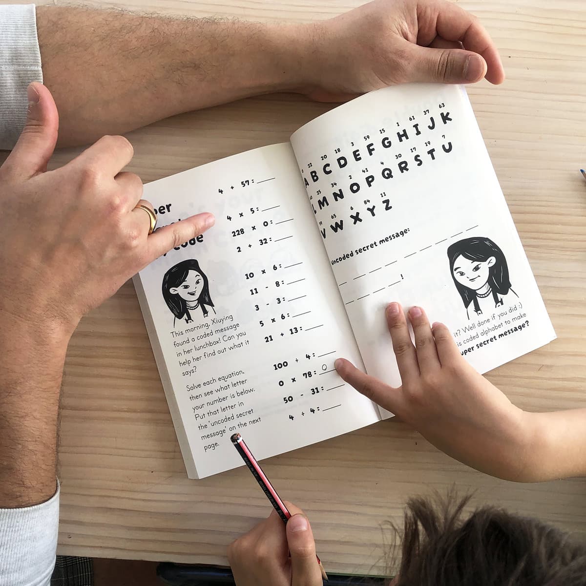 Parent shows kid the secret code cracker page